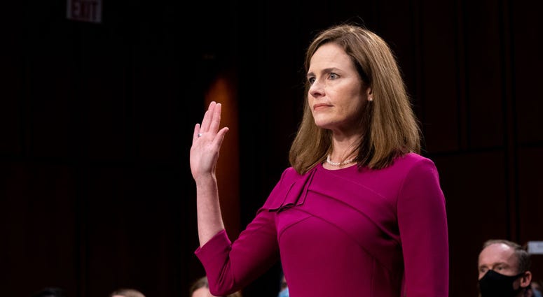 Supreme Court Justice nominee Judge Amy Coney Barrett is sworn in during the Senate Judiciary Committee confirmation hearing for Supreme Court Justice in the Hart Senate Office Building on October 12, 2020 in Washington, DC.