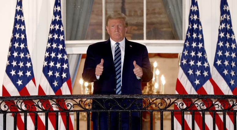 U.S. President Donald Trump gives a thumbs up upon return to the White House from Walter Reed National Military Medical Center on October 05, 2020 in Washington, DC.
