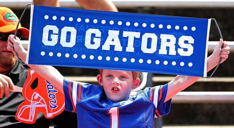 A Florida Gators fan cheers during a game at Ben Hill Griffin Stadium