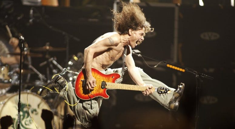 In this June 22, 2004, file photo, Eddie Van Halen plays the final chord of "Jump" during the Van Halen concert at the Continental Airlines Arena in East Rutherford, N.J.