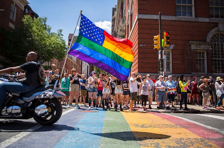PHILADELPHIA, PA - JUNE 12: Participants of the 2016 Pride Parade march through downtown on June 12, 2016 in Philadelphia, Pennsylvania. The mood was celebratory despite news of the mass shooting this morning in a gay club in Orlando, Florida.