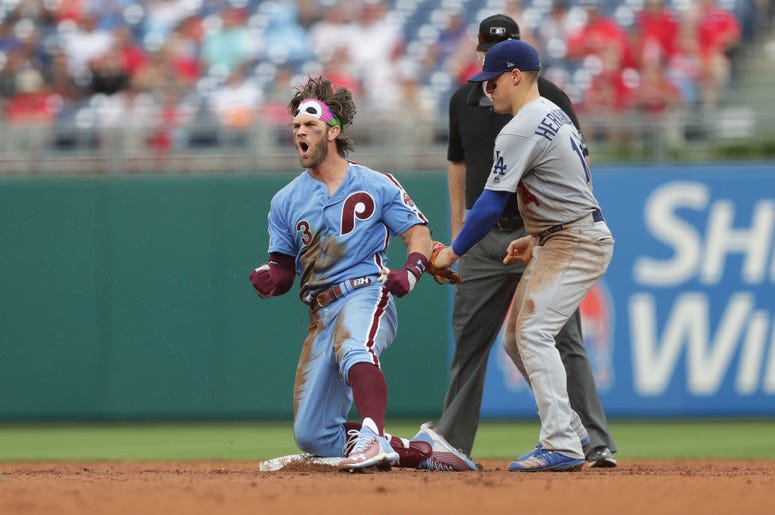 Bryce Harper Bryce Harper #3 of the Philadelphia Phillies reacts after hitting a single and taking second base on an error that scored a run in the seventh inning during a game against the Los Angeles Dodgers at Citizens Bank Park.