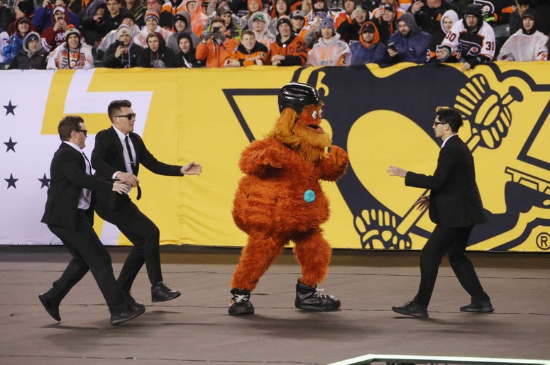 PHILADELPHIA, PENNSYLVANIA - FEBRUARY 23: The Philadelphia Flyers mascot Gritty runs through the infield during the game against the Pittsburgh Penguins during the 2019 Coors Light NHL Stadium Series game at the Lincoln Financial Field on February 23, 201