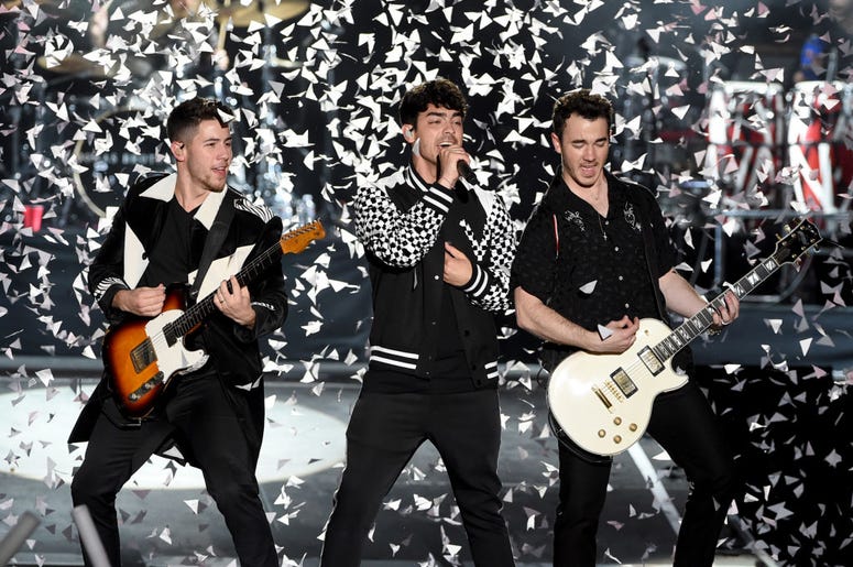 Nick Jonas, Joe Jonas and Kevin Jonas Nick Jonas, Joe Jonas and Kevin Jonas of the Jonas Brothers perform onstage