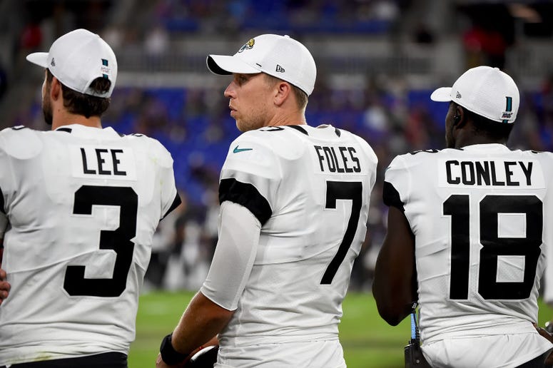 Tanner Lee #3, Nick Foles #7 and Chris Conley #18 Tanner Lee #3, Nick Foles #7 and Chris Conley #18 of the Jacksonville Jaguars look on from the sideline during the second half of a preseason game against the Baltimore Ravens at M&T Bank Stadium on August 8, 2019 in Baltimore, Maryland.