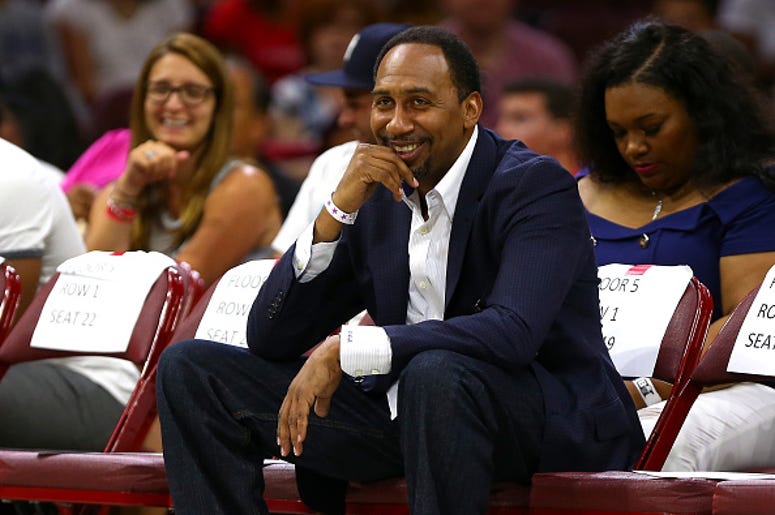 Stephen A. Smith Stephen A. Smith watches a basketball game courtside.