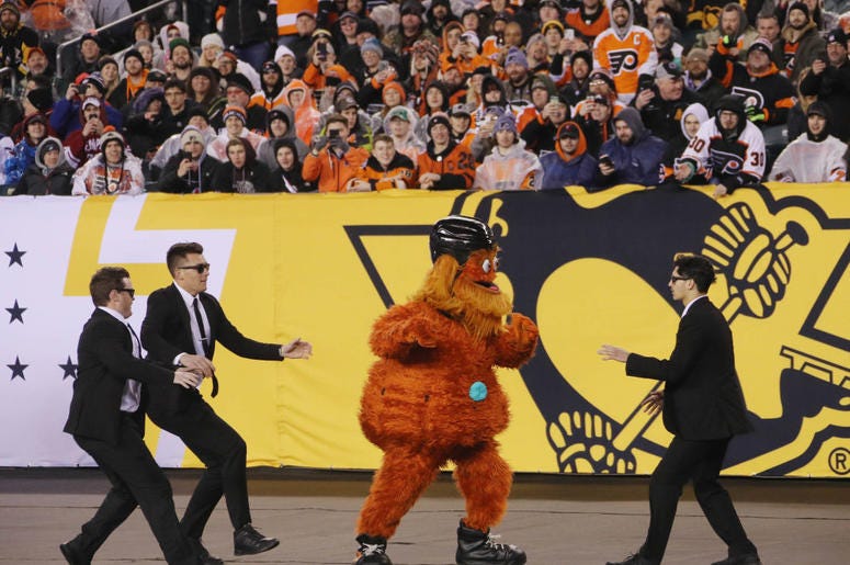 PHILADELPHIA, PENNSYLVANIA - FEBRUARY 23: The Philadelphia Flyers mascot Gritty runs through the infield during the game against the Pittsburgh Penguins during the 2019 Coors Light NHL Stadium Series game at the Lincoln Financial Field on February 23, 201