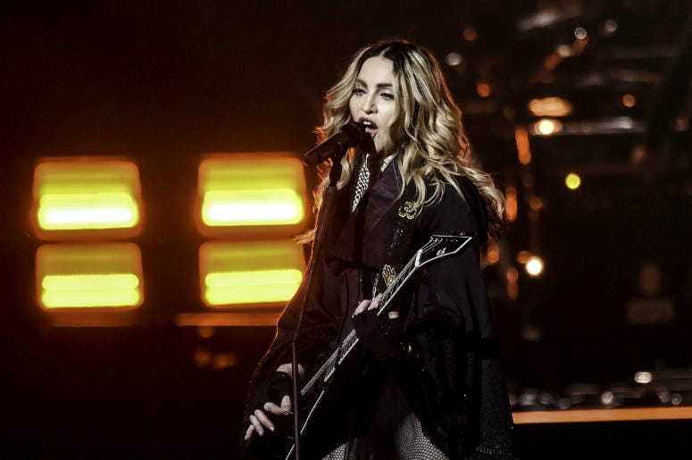 Jan 23, Miami, FL, USA; Recording artist Madonna performs during her Rebel Heart Tour stop at the American Airlines Center. Jan 23, Miami, FL, USA; Recording artist Madonna performs during her Rebel Heart Tour stop at the American Airlines Center.