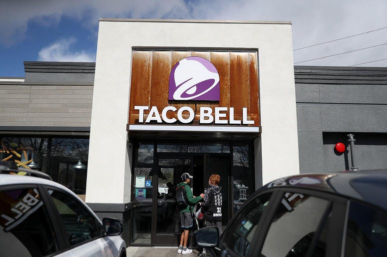 Taco Bell Customers enter a Taco Bell restaurant on February 22, 2018 in Novato, California. Taco Bell has become the fourth-largest domestic restaurant brand by edging out Burger King. Taco Bell sits behind the top three restaurant chains McDonald's, Starbucks and