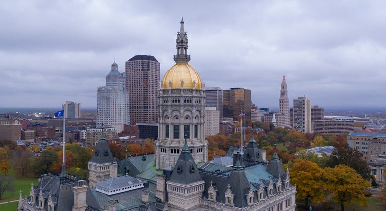 Downtown buildings under a dark sky at the Connecticut state capitol building in Hartford