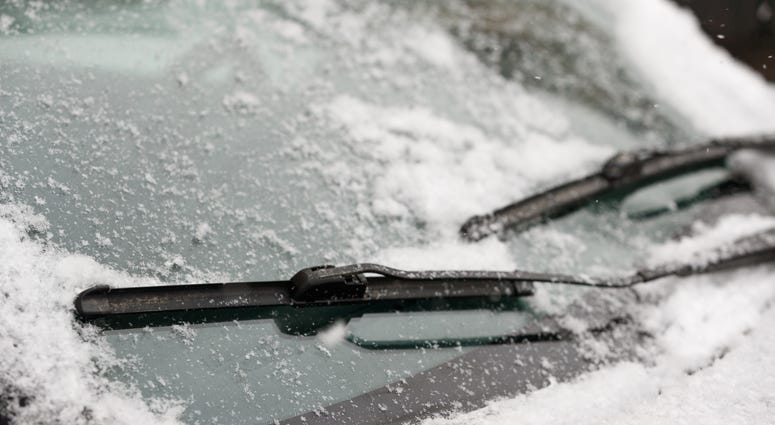 Snow on car windshield