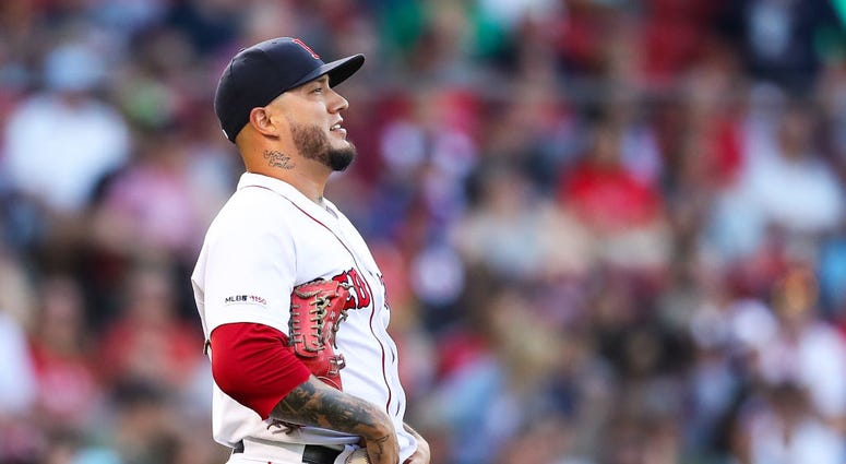 BOSTON, MA - AUGUST 10: Hector Velazquez #76 of the Boston Red Sox reacts after giving up a run to Shohei Ohtani #17 of the Los Angeles Angels in the seventh inning of a game at Fenway Park on August 10, 2019 in Boston, Massachusetts. (Photo by Adam Glanz