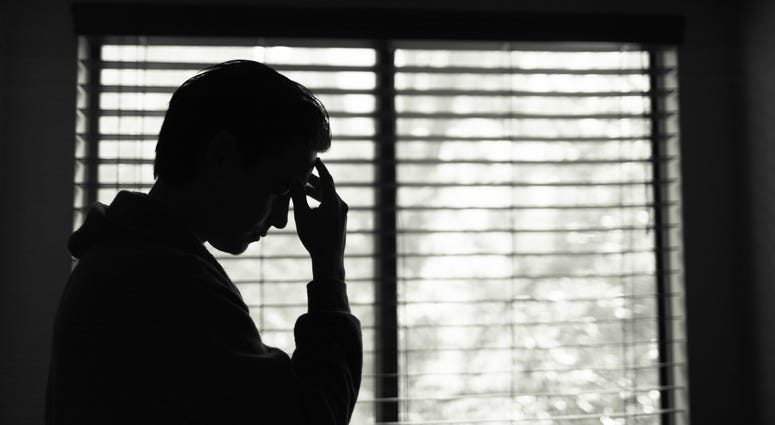 Silhouette of Stressed Man