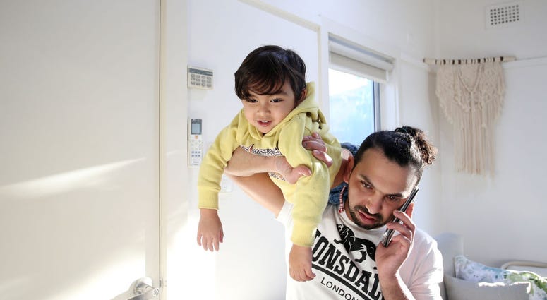 Guy on phone with kid