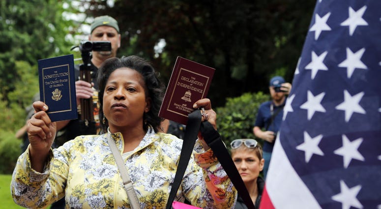 Woman holding Constitution and Declaration