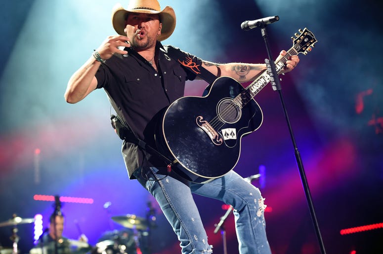 Jason Aldean performing on stage. Jason Aldean