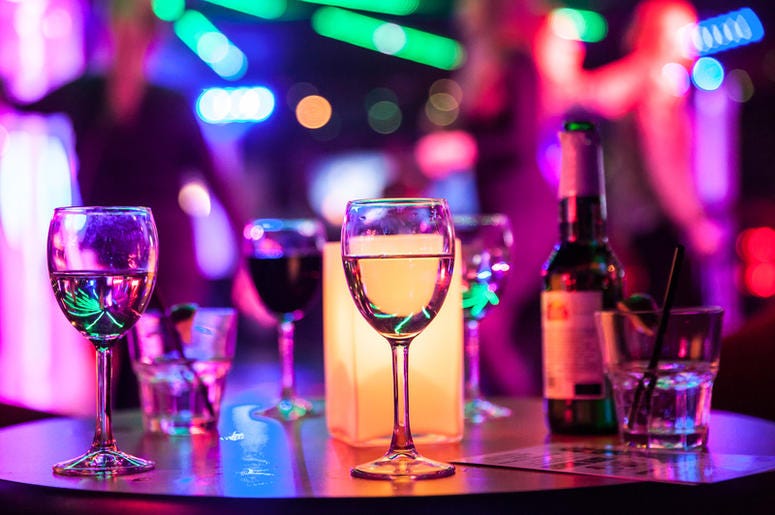 A table full of alcoholic drinks. Adult Beverages