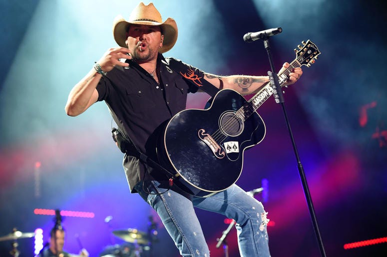 Jason Aldean performing on stage. Jason Aldean