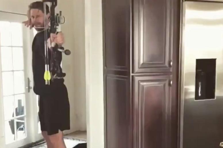 Chase Rice shooting a bow and arrow Chase Rice shooting a bow and arrow