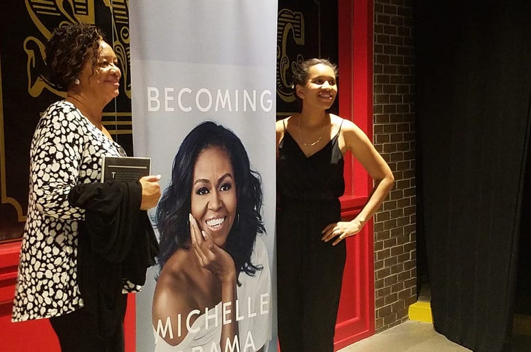 Along with plenty of merchandise for sale, there were also plenty of areas for event-goers to get a photo with Michelle Obama at no cost. Along with plenty of merchandise for sale, there were also plenty of areas for event-goers to get a photo with Michelle Obama at no cost.