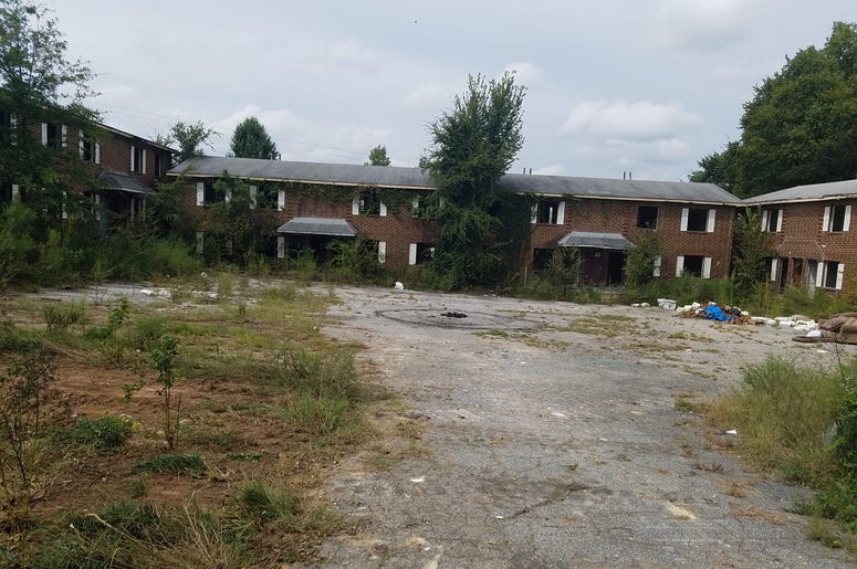 Bolton Road Apartments being taken down by a bulldozer in Northwest Atlanta.