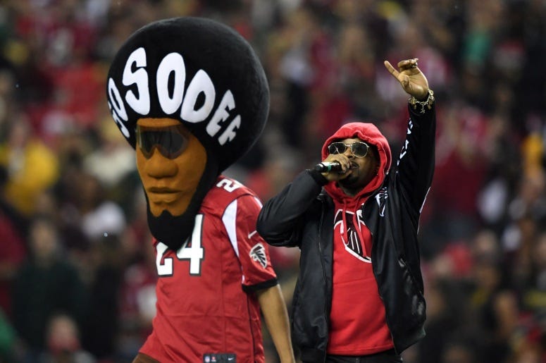 Jermaine Dupri performs with So So Def mascot Jermaine Dupri performs with So So Def mascot