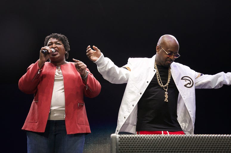 Stacey Abrams and Jermaine Dupri on stage at State Farm Arena Stacey Abrams and Jermaine Dupri on stage at State Farm Arena