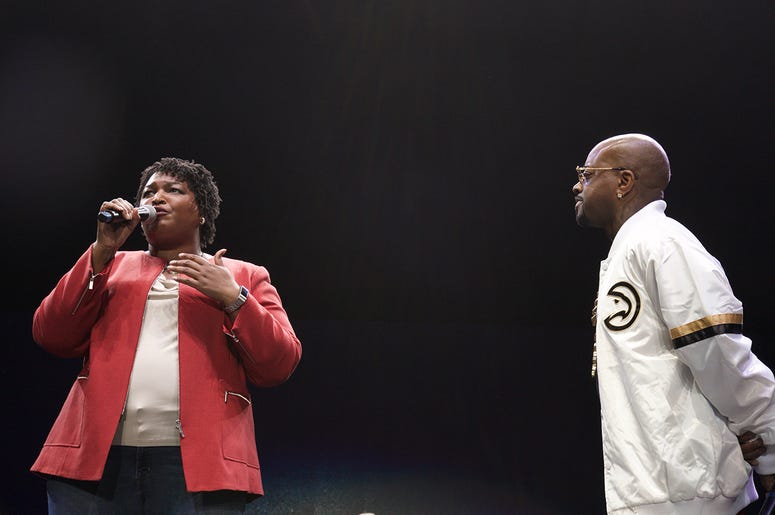 Stacey Abrams and Jermaine Dupri on stage at State Farm Arena Stacey Abrams and Jermaine Dupri on stage at State Farm Arena