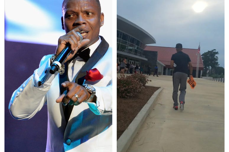 Singer Ron Devoe walks to Monday's community forum on toxic air carrying orange protest sign. Singer Ron Devoe walks to Monday's community forum on toxic air carrying orange protest sign.