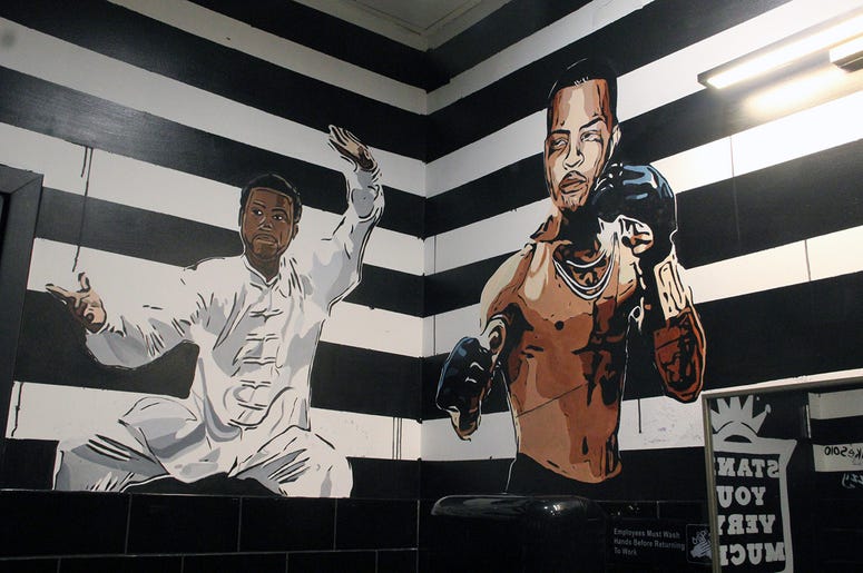 A mural of Gucci Mane and T.I. in Slim & Husky's bathroom A mural of Gucci Mane and T.I. in Slim & Husky's bathroom