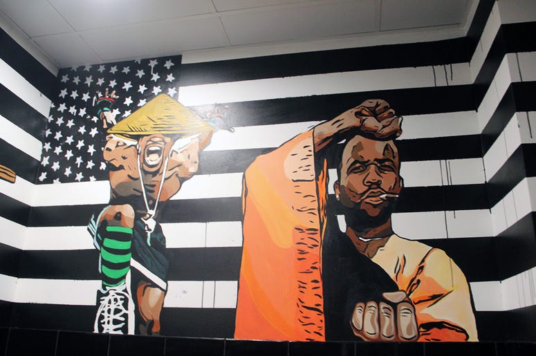 A mural of OutKast in the restroom at Slim & Husky's on Howell Mill Road in Atlanta A mural of OutKast in the restroom at Slim & Husky's on Howell Mill Road in Atlanta