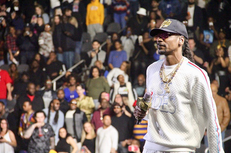 Snoop Dogg performs at Atlanta's State Farm Arena during the Puff Puff Pass Tour Snoop Dogg performs at Atlanta's State Farm Arena during the Puff Puff Pass Tour