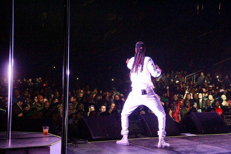Snoop Dogg performs at Atlanta's State Farm Arena during the Puff Puff Pass Tour Snoop Dogg performs at Atlanta's State Farm Arena during the Puff Puff Pass Tour