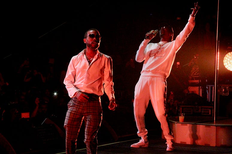 Snoop Dogg and Lil Duval perform at Atlanta's State Farm Arena during the Puff Puff Pass Tour Snoop Dogg and Lil Duval perform at Atlanta's State Farm Arena during the Puff Puff Pass Tour