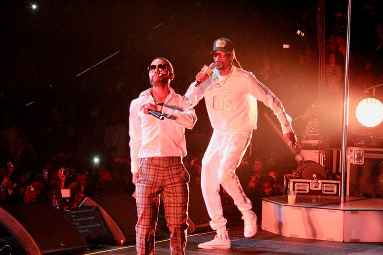 Snoop Dogg and Lil Duval perform at Atlanta's State Farm Arena during the Puff Puff Pass Tour Snoop Dogg and Lil Duval perform at Atlanta's State Farm Arena during the Puff Puff Pass Tour