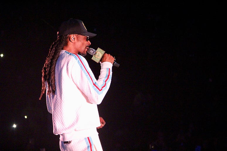 Snoop Dogg performs at Atlanta's State Farm Arena during the Puff Puff Pass Tour Snoop Dogg performs at Atlanta's State Farm Arena during the Puff Puff Pass Tour