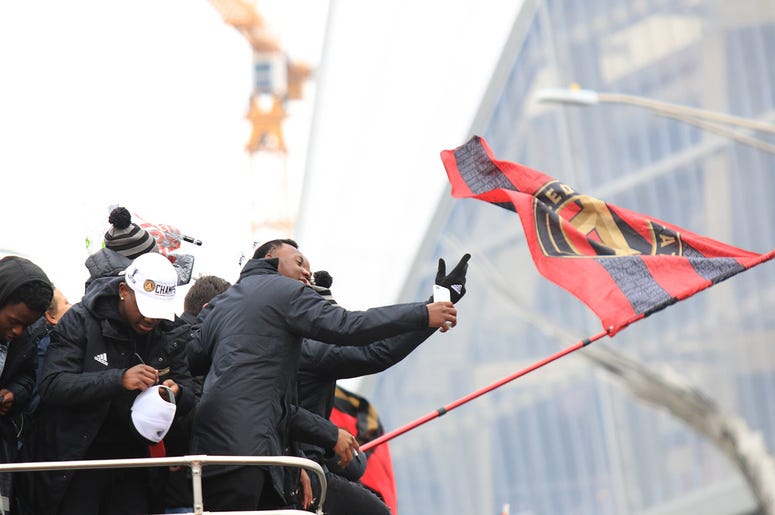 Atlanta United team members celebrate during victory parade Atlanta United team members celebrate during victory parade