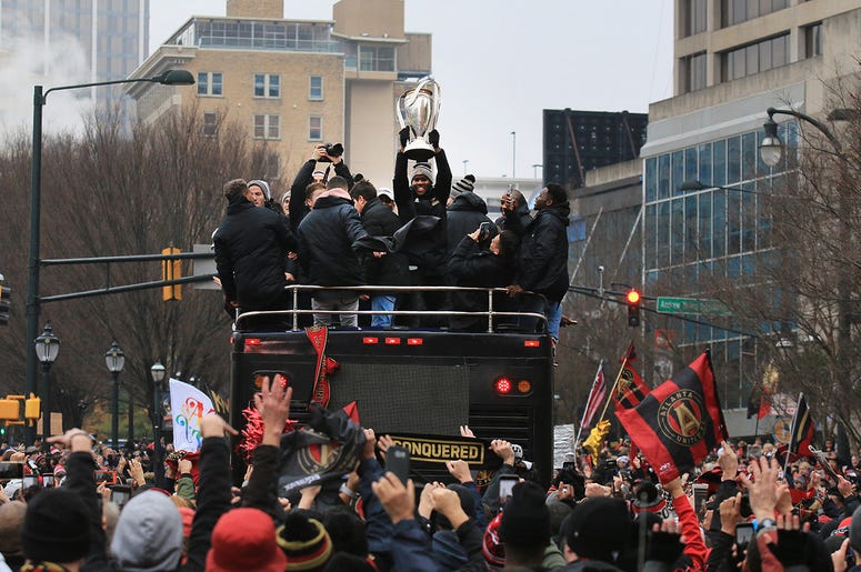 Atlanta United team members celebrate during victory parade Atlanta United team members celebrate during victory parade