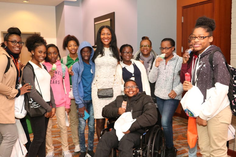 Fulton Commissioner Natalie Hall is shown with teens during a previous CEO's conference Fulton Commissioner Natalie Hall is shown with teens during a previous CEO's conference