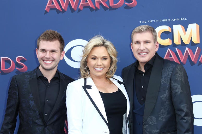 Reality TV stars Todd (far right) and Julie Chrisley (middle) of "Chrisley Knows Best" have been indicted by a federal grand jury in Atlanta Reality TV stars Todd (far right) and Julie Chrisley (middle) of "Chrisley Knows Best" have been indicted by a federal grand jury in Atlanta