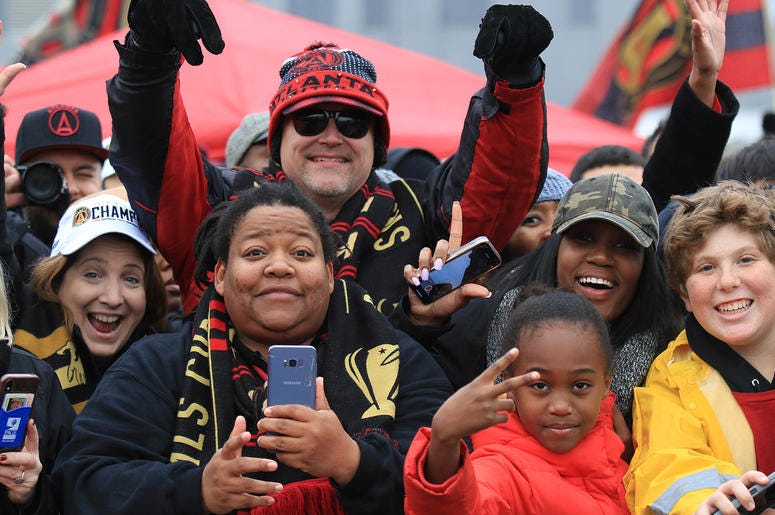 Atlanta United fans celebrate during victory parade Atlanta United fans celebrate during victory parade
