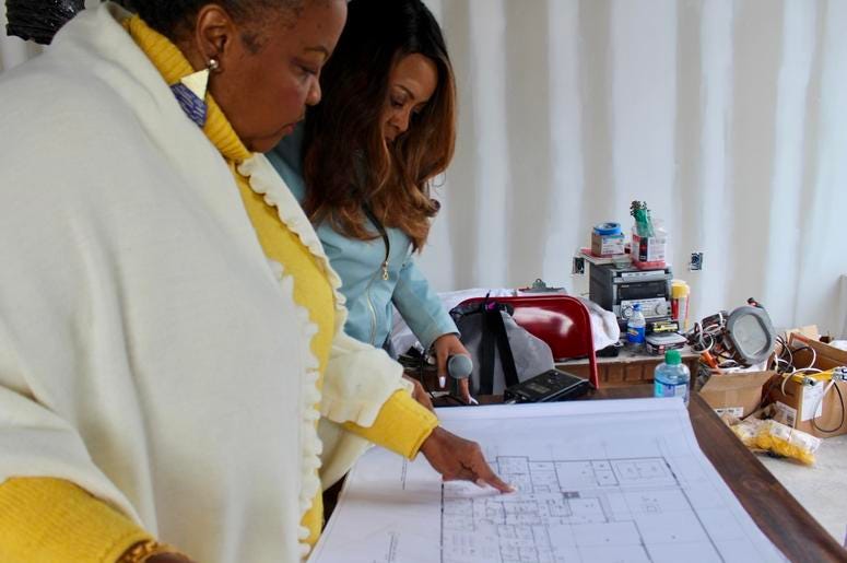 Elisabeth Omilami goes over floor plans for the new Hosea Helps facility in southwest Atlanta Elisabeth Omilami goes over floor plans for the new Hosea Helps facility in southwest Atlanta