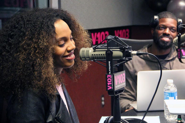 Jade Novah and JR of The Morning Culture smile during their first day on-air at V-103 Jade Novah and JR of The Morning Culture smile during their first day on-air at V-103