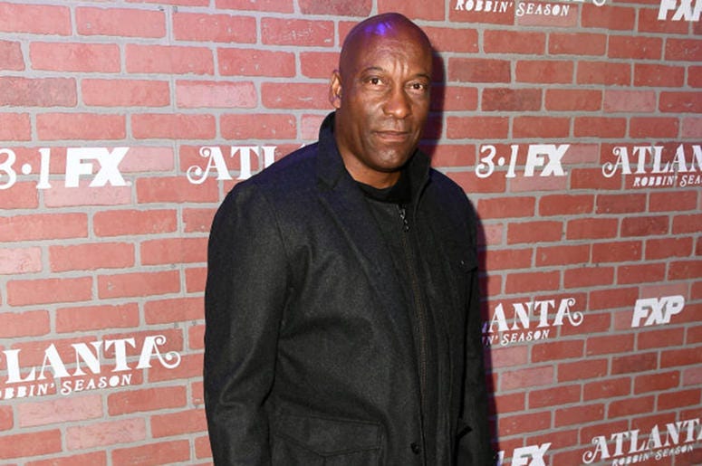 John Singleton attends the premiere for FX's "Atlanta Robbin' Season" at The Theatre at Ace Hotel on February 19, 2018 in Los Angeles, California. John Singleton attends the premiere for FX's "Atlanta Robbin' Season" at The Theatre at Ace Hotel on February 19, 2018 in Los Angeles, California.
