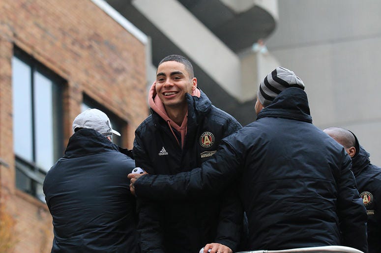 Atlanta United midfielder Miguel Almirón celebrates during victory parade Atlanta United midfielder Miguel Almirón celebrates during victory parade