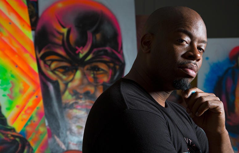 Fabian Williams poses in front of one of his paintings Fabian Williams poses in front of one of his paintings