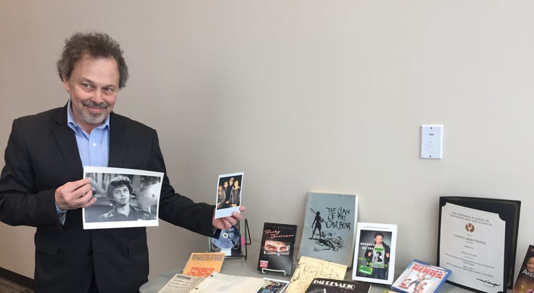 Curtis Armstrong shows off items from his collection