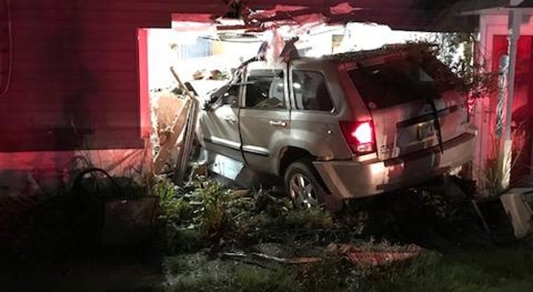 Orion SUV into house Orion SUV into house