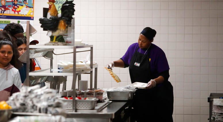 Nicole Johnson prepares lunch for students Nicole Johnson prepares lunch for students