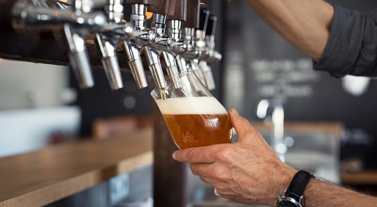 A draft beer pouring from a tap